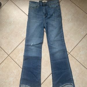 Asymmetrical flared denim jeans